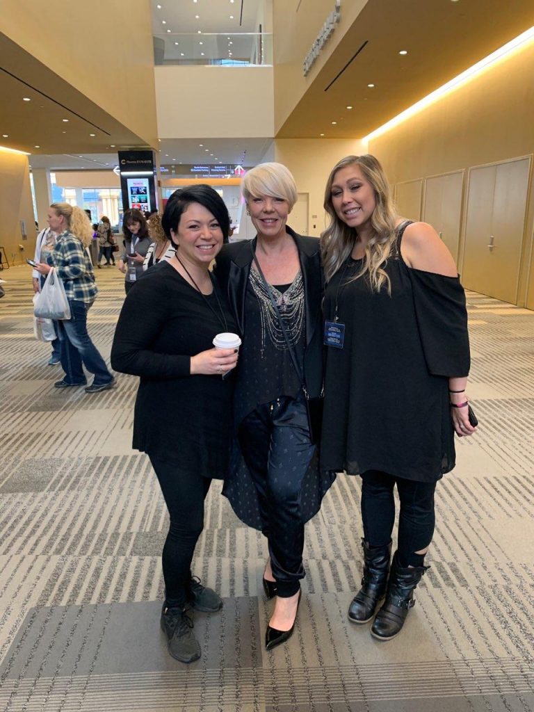 Tabitha Coffey with two cosmetology students