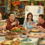 The cast of Friends acting out Thanksgiving dinner.