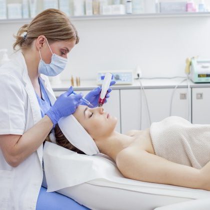 Esthetician Performing Medical Skin Care Treatment on Client